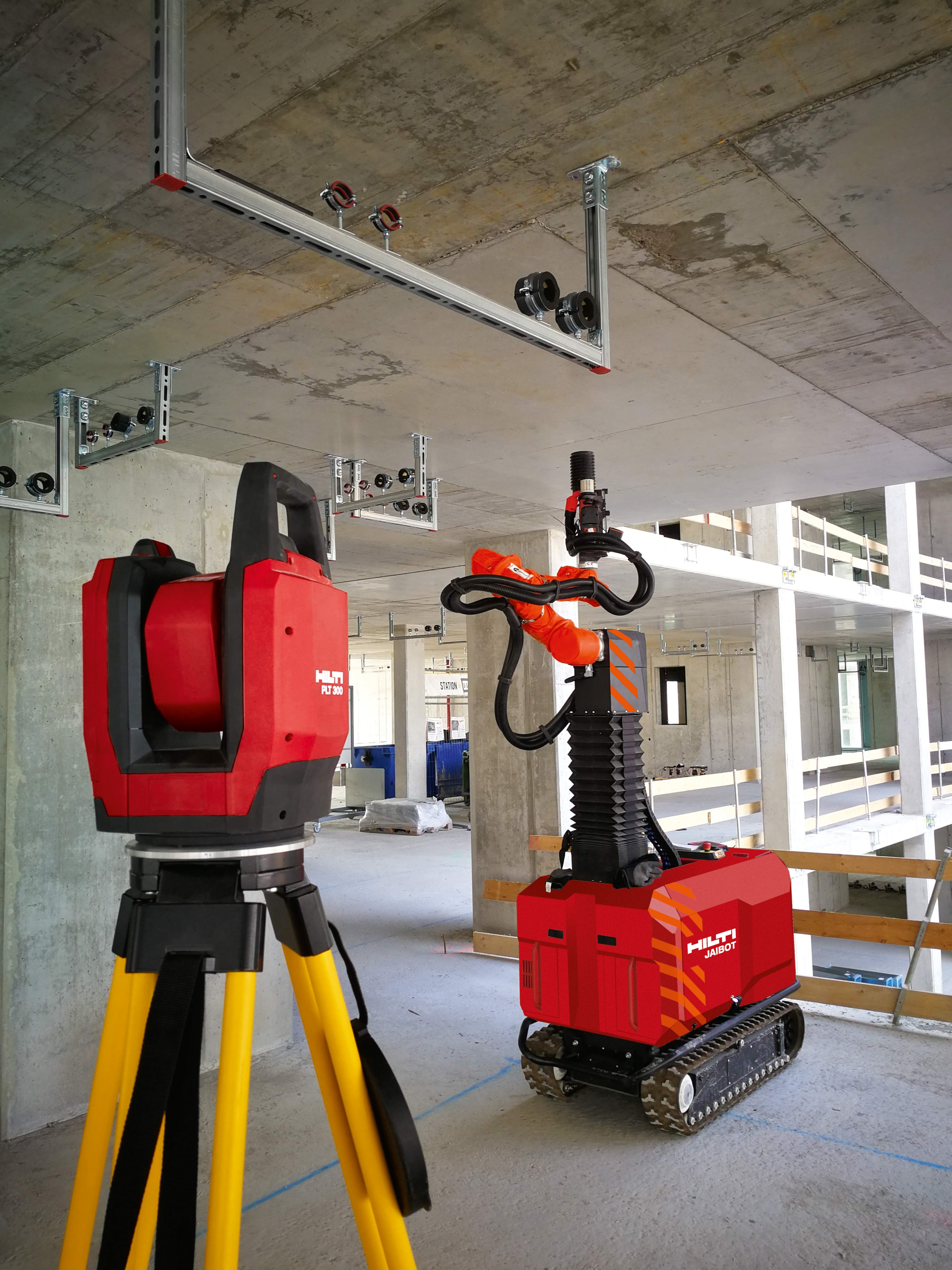 MEP installation system, total station and drilling robot on a construction site