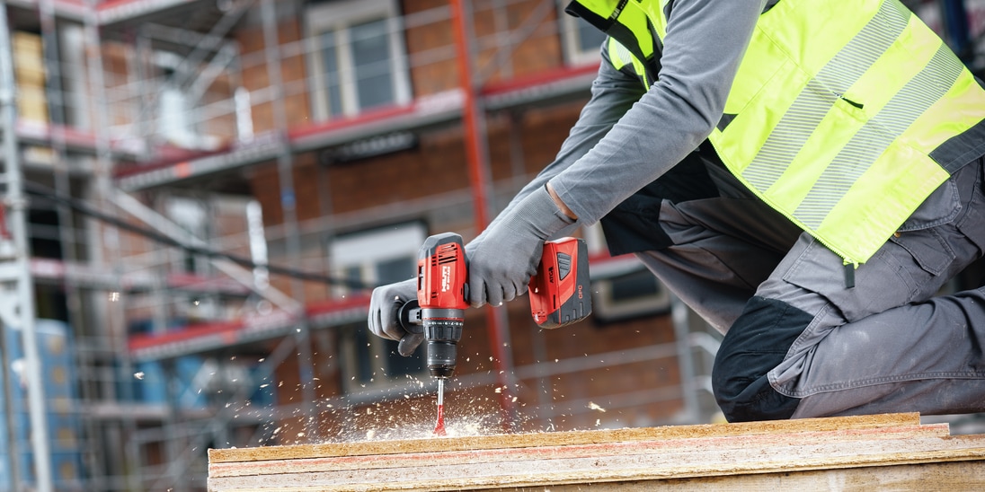 Construction worker using a n SF 6H-A22 Cordless hammer drill driver with Active Torque Control (ATC) to help prevent kickback